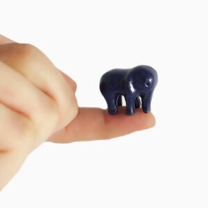 blue elephant on finger